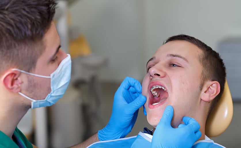 Young adult man getting a cavity filled