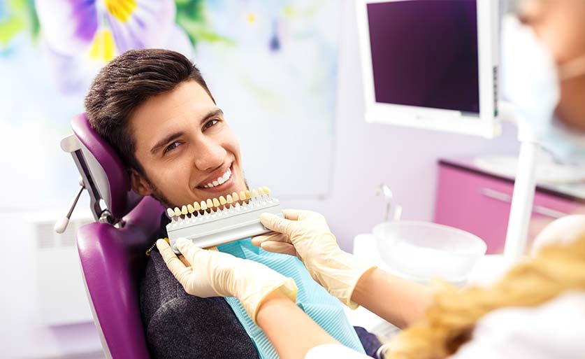 Young adult man at a teeth whitening appointment